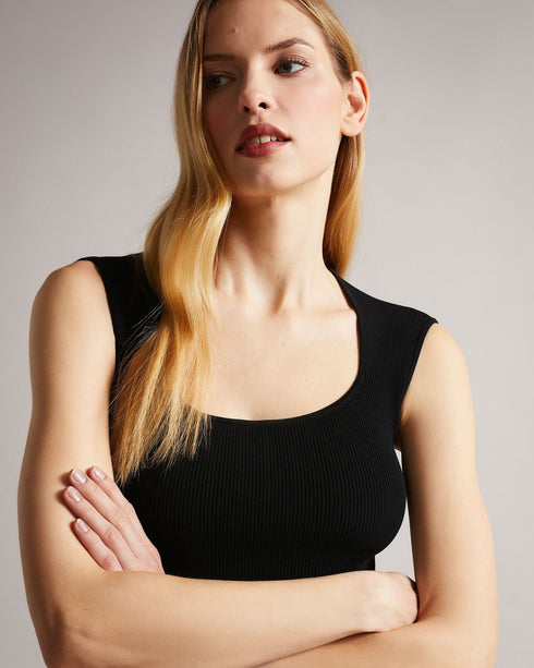 JUDIT-Dresses-JUDIT is the flower of the flock. This tulip dress is enhanced with a scooped neckline and an exposed zip on the back that adds a touch of extra drama to its sophisticated look. Take this dress from the office to the bar, and turn heads wherever you go. Mini dress Tulip skirt Compact knit Slight stretch Sleeveless Scoop neck Zip back Karolina is 5'10" / 1.78m and wears Black in a Ted size 1- Ted Baker Romania